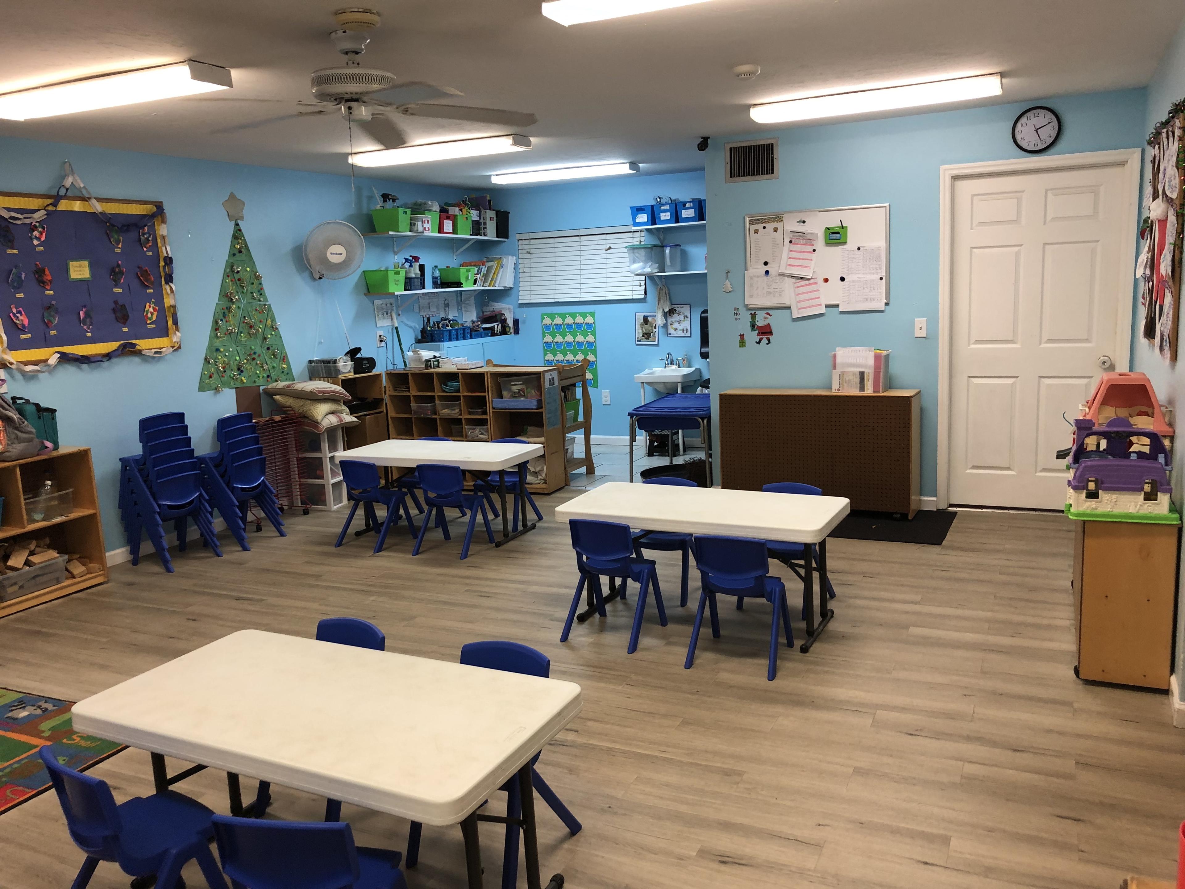 Badgers two-year-old classroom overview with tables and play areas