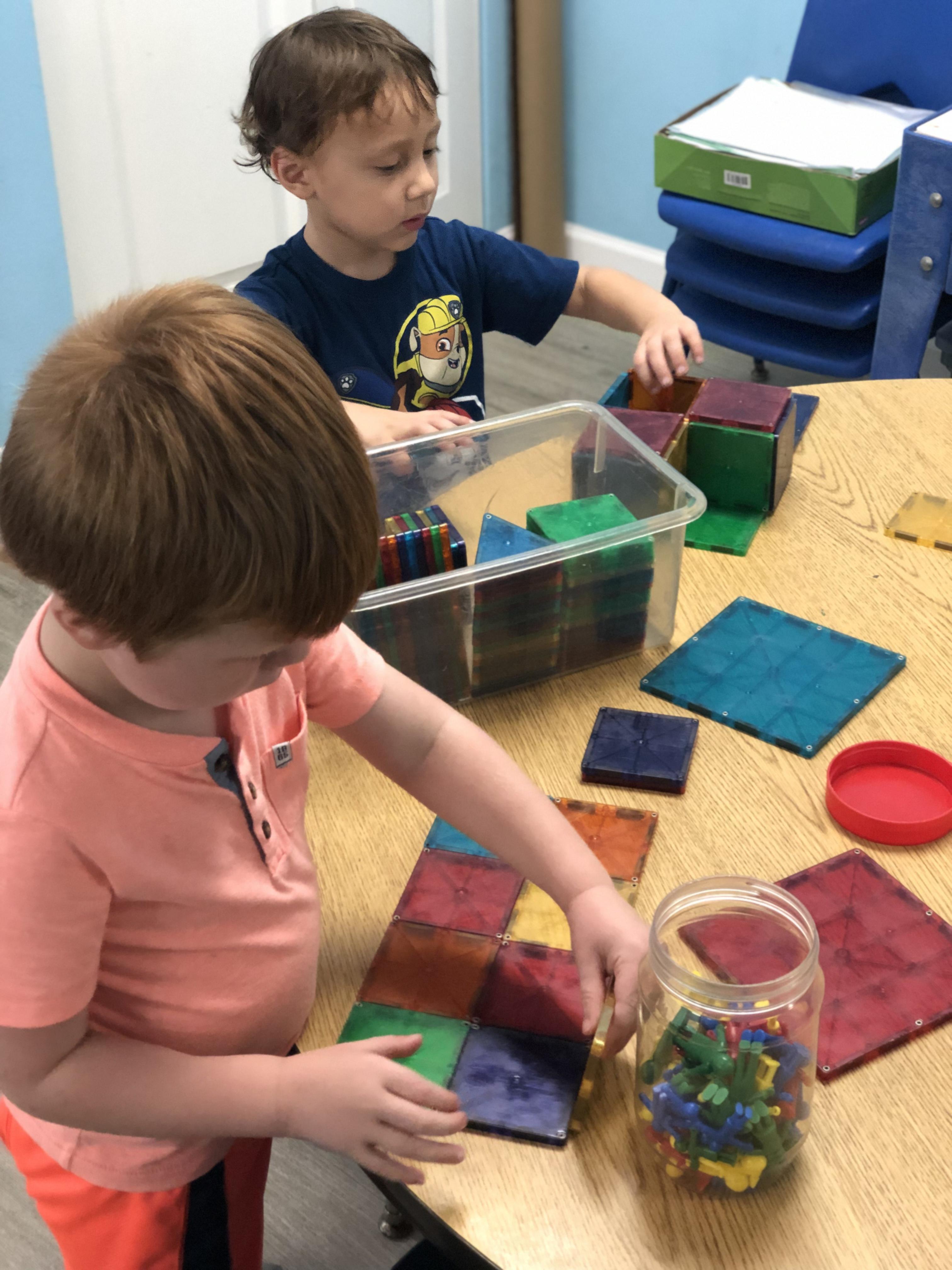 Child exploring an art activity at Toad Hall